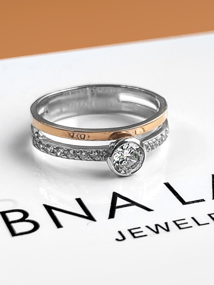 Pierścionek z cyrkonem. Srebro 925°, złoto 375° 495 tys